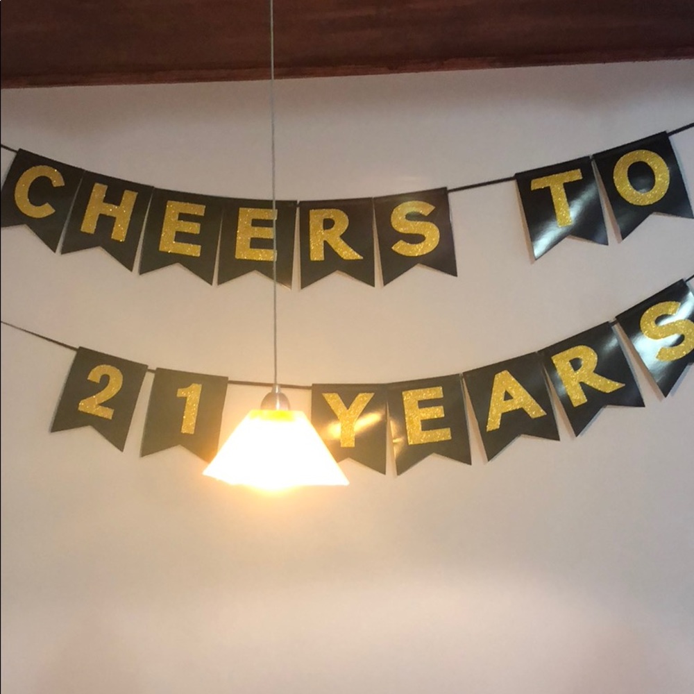 “cheers to 21 years” party banner